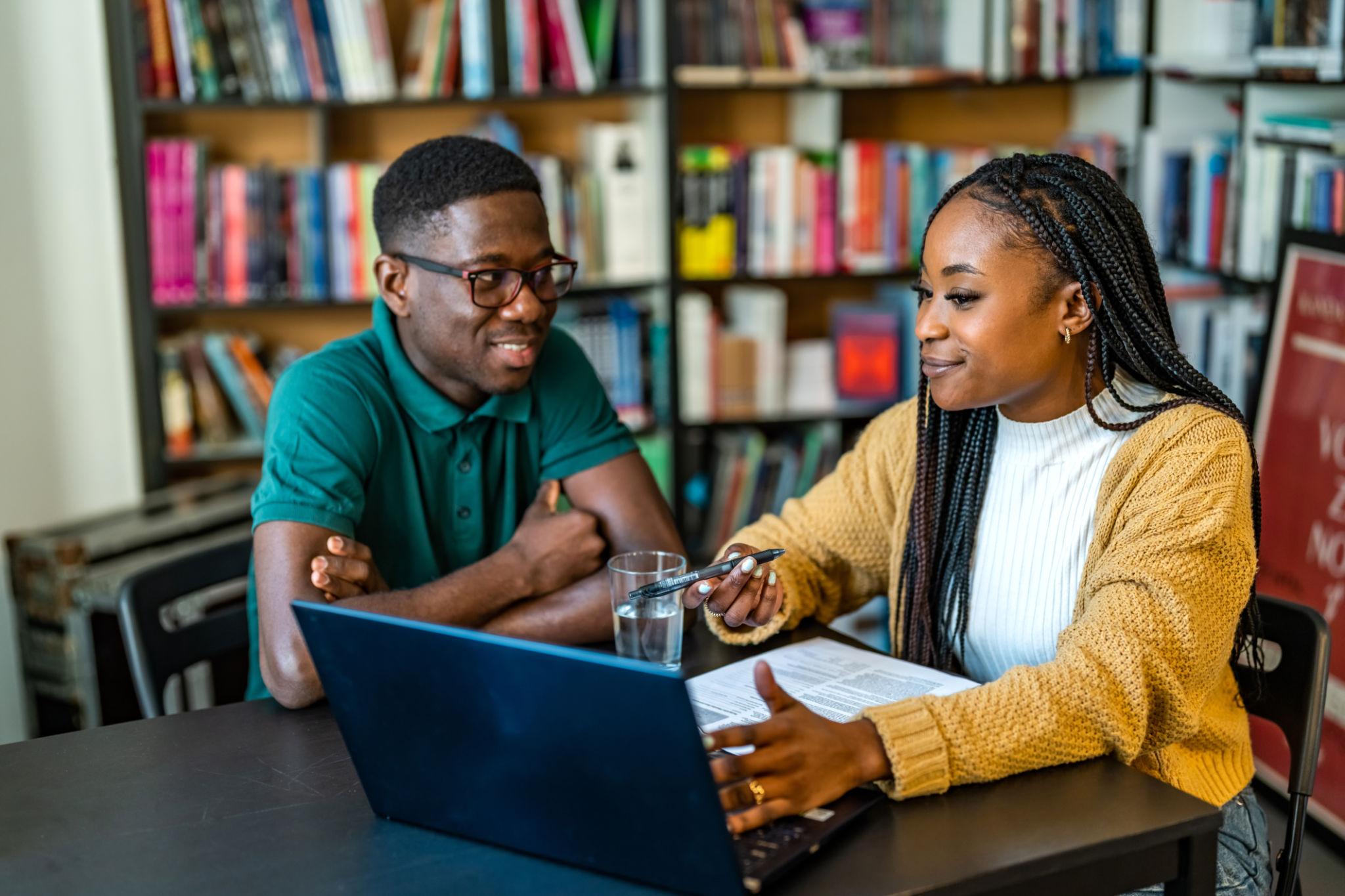 Tutor helping student learn